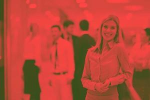 business woman with her staff in background at office photo