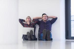 startup business, couple working on laptop computer at office photo