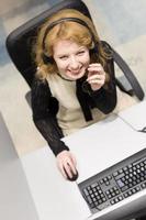 female call centre operator doing her job top view photo