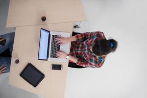 top view of young business woman working on laptop photo