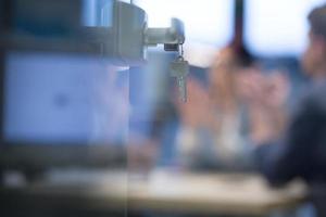 Open  glass door with keys photo