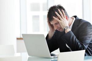 young business man alone in conference room photo