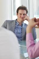 young business man alone in conference room photo