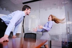 Angry busines sman screaming at employee photo