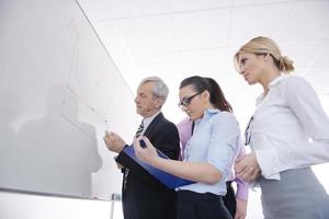 Senior business man giving a presentation photo