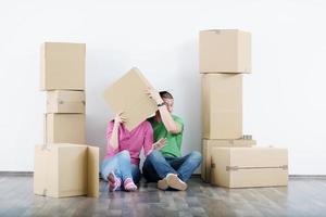 Young couple moving in new house photo