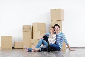 Young couple moving in new house photo