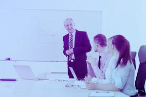 Senior business man giving a presentation photo