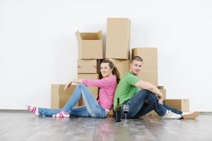 Young couple moving in new house photo