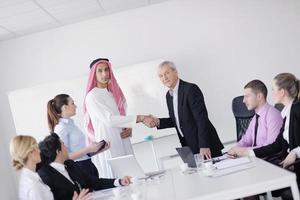 business woman standing with her staff in background photo