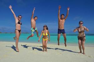 group of happy young people have fun on bach photo