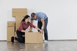 Young couple moving in new house photo