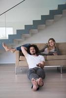 young couple relaxes in the living room photo