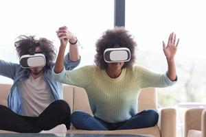 Multiethnic Couple using virtual reality headset photo