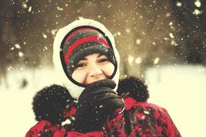 Portrait of young woman on snowy winter day photo