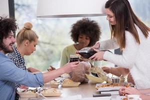 multiethnic group of happy friends lunch time photo