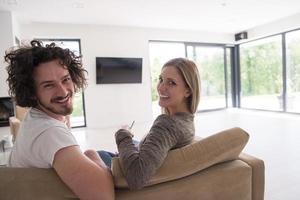 Rear view of couple watching television photo