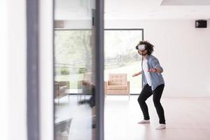 man using VR-headset glasses of virtual reality photo