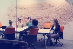 startup business team using virtual reality headset photo