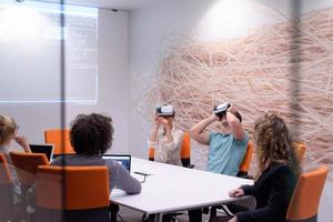 startup business team using virtual reality headset photo