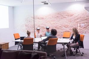 startup business team using virtual reality headset photo