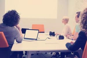 Startup Business Team At A Meeting at modern night office building photo