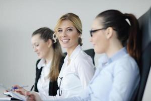 business woman standing with her staff in background photo