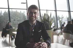 business man portrait at modern  office photo