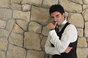 Indoor portrait of young and happy  businessman photo