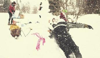 group of young people having fun in beautiful winter landscape photo