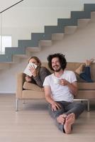 couple relaxing at  home with tablet computers photo