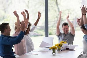 multiethnic startup Group of young business people throwing documents photo