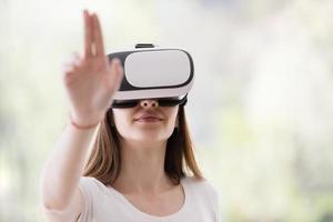 woman using VR-headset glasses of virtual reality photo