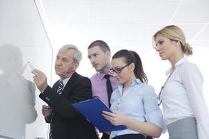 Senior business man giving a presentation photo