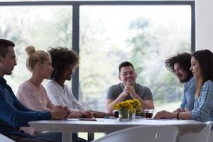 Multiethnic startup Business Team At A Meeting at modern office building photo