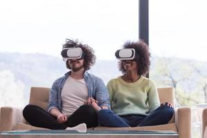Multiethnic Couple using virtual reality headset photo