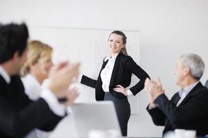 Group of young business people at meeting photo