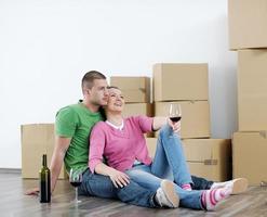 Young couple moving in new house photo