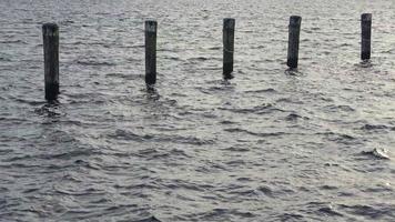 Detailed close up view on water surfaces with ripples and waves and the sunlight reflecting at the surface video