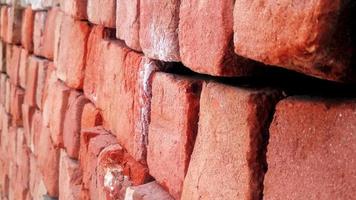 Red brick wall. Texture of old dark brown and red brick wall background photo