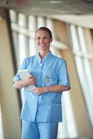 female doctor with tablet computer photo