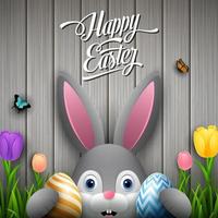 Happy easter with rabbit holding two egg colorful on wooden brown background vector