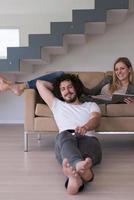 young couple relaxes in the living room photo