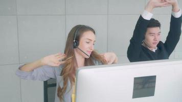 Customer service with friendly, man and woman call center and operator for support client, group of business team with assistance and consultant, adviser exercise and relax, communication concept. video