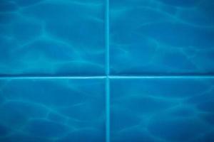 Blue tiles with seawater pattern, background and texture photo