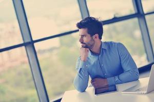 happy young business man at office photo