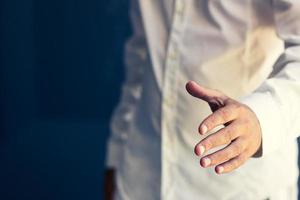 Left handed man shaking hands. photo