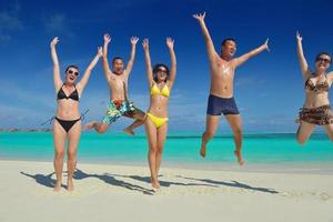 group of happy young people have fun on bach photo