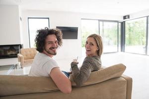 Rear view of couple watching television photo