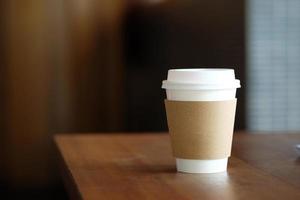 Paper coffee cup in coffee shop. photo